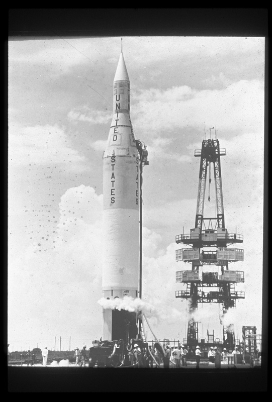 black and white photograph of United States rocket on launch pad with Explorer payload