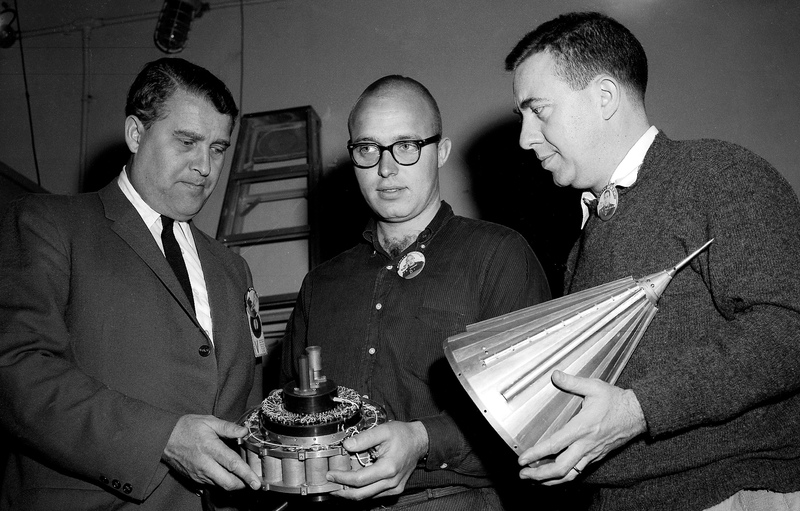 Dr. Wernher von Braun, left, John Casani of the Jet Propulsion Laboratory, center, and Dr. James Van Allen, inspect components of the Pioneer IV spacecraft on March 1, 1959