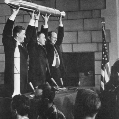 Iconic image of Oickering, Van Allen and Von Braun holding replica of Explorer 1 over their heads