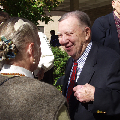 James Van Allen smiling as he speaking with old collegues