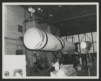 Vanguard rocket body freshly painted being hoisted into rocket cradle