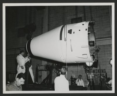 Several men inspecting the Vanguard rocket nose